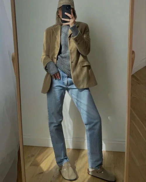 Effortless Chic: Camel Blazer, Grey Sweater, and Light Wash Jeans for Versatile Style