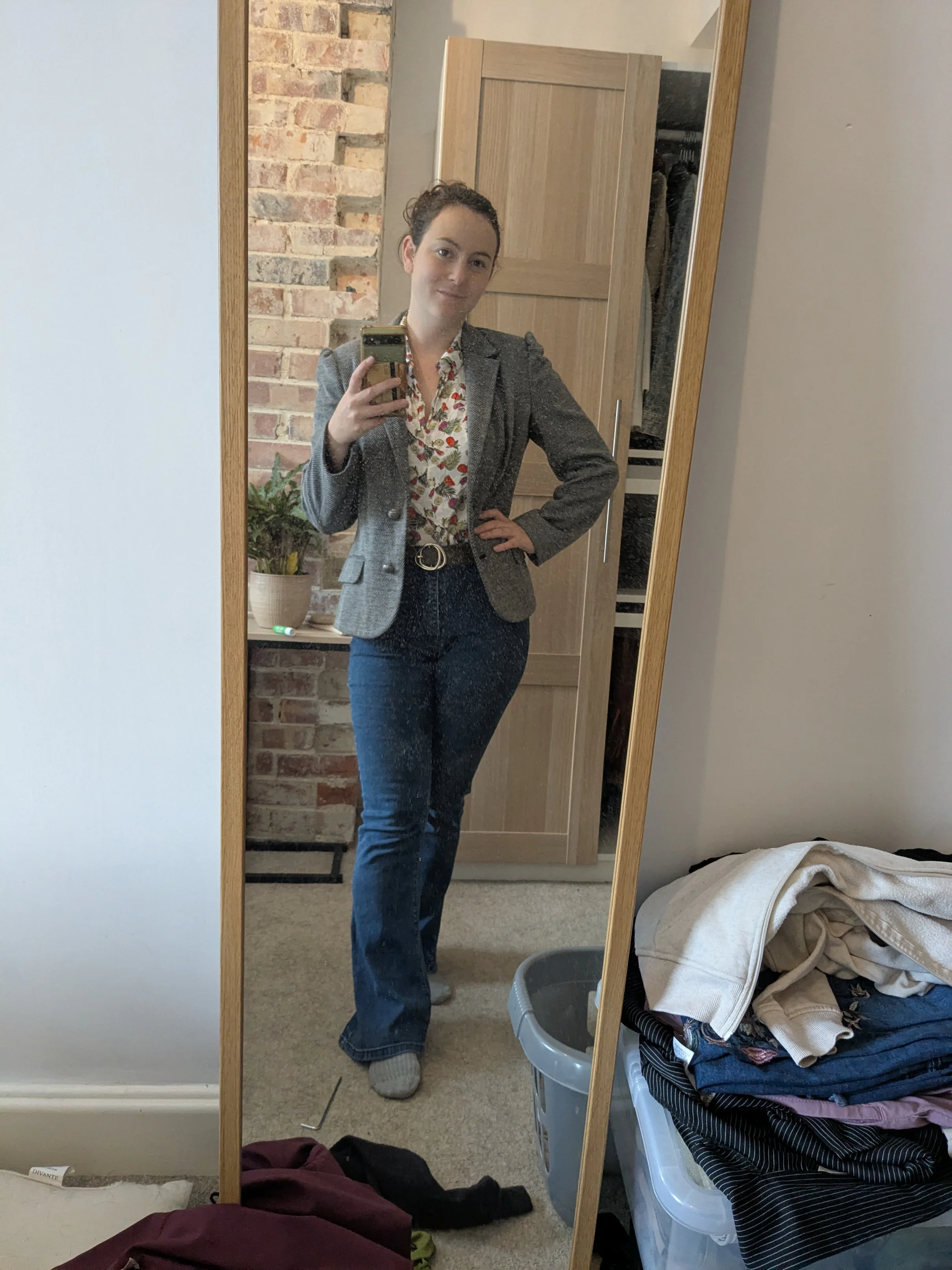 Gray Blazer and Floral Blouse with Jeans for a Smart-Casual Look