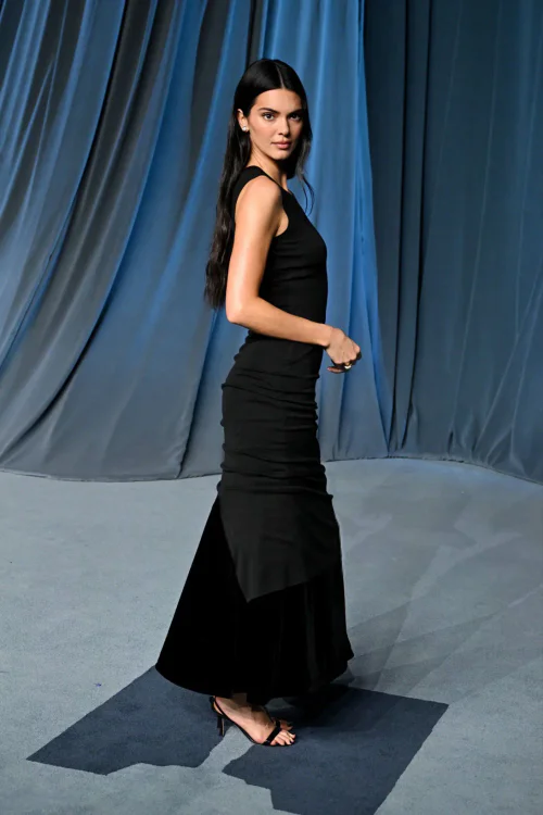 Kendall Jenner make a stunning appearance at the Annual Academy Museum Gala. Sophisticated Black Gown with Strappy Heels and Minimalist Elegance