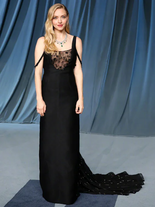 Amanda Seyfried in Prada. Elegant Black Gown with Sheer Embellished Bodice and Dramatic Train