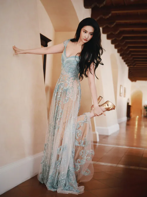 Liu Yifei in Elegant Blue Embellished Gown with Gold Accessories for a Sophisticated Look