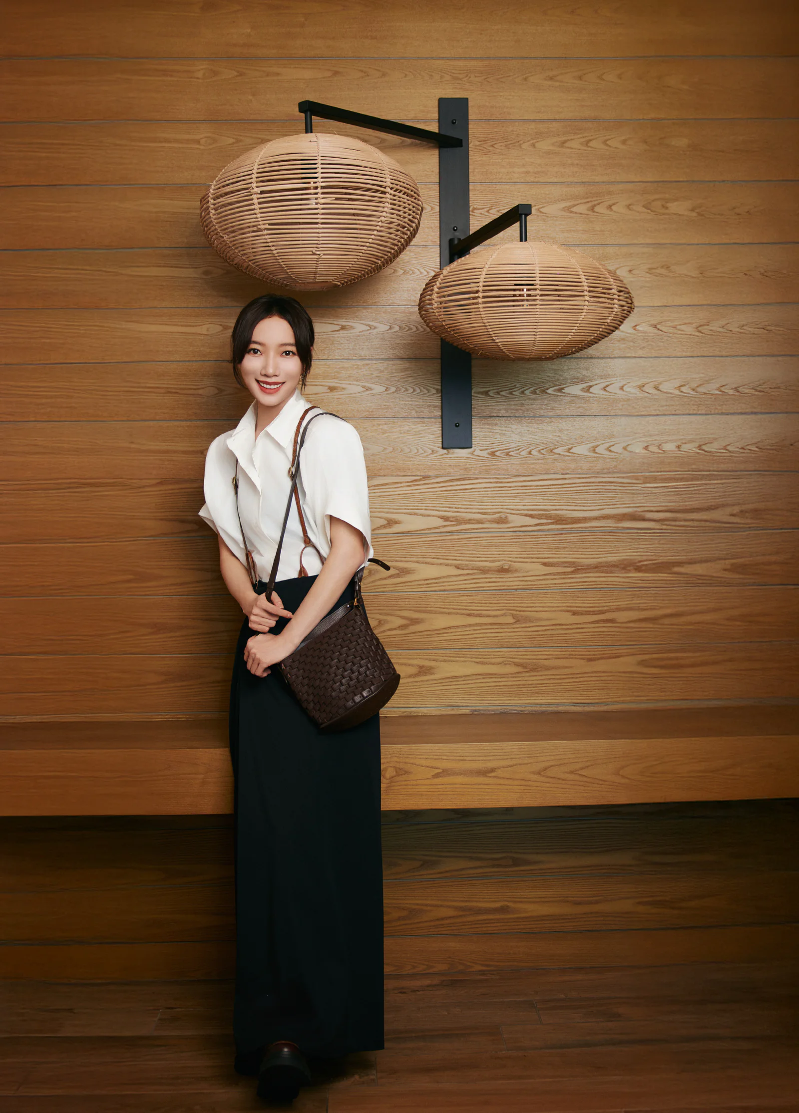 Elegant Black-and-White Outfit with Tailored Trousers and Asymmetric White Top
