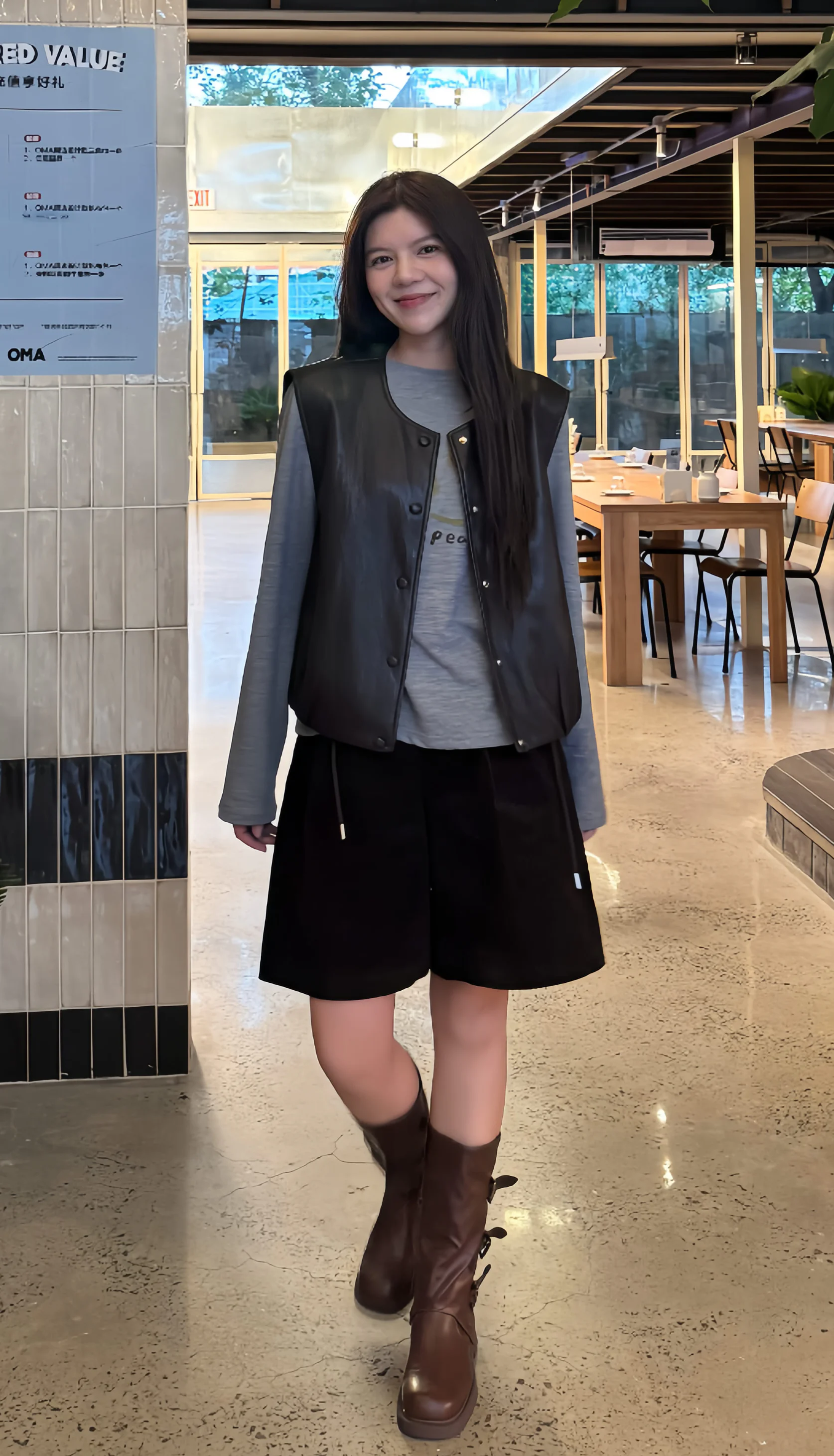 Casual Edgy Style with Leather Vest, Black Shorts, and Brown Boots