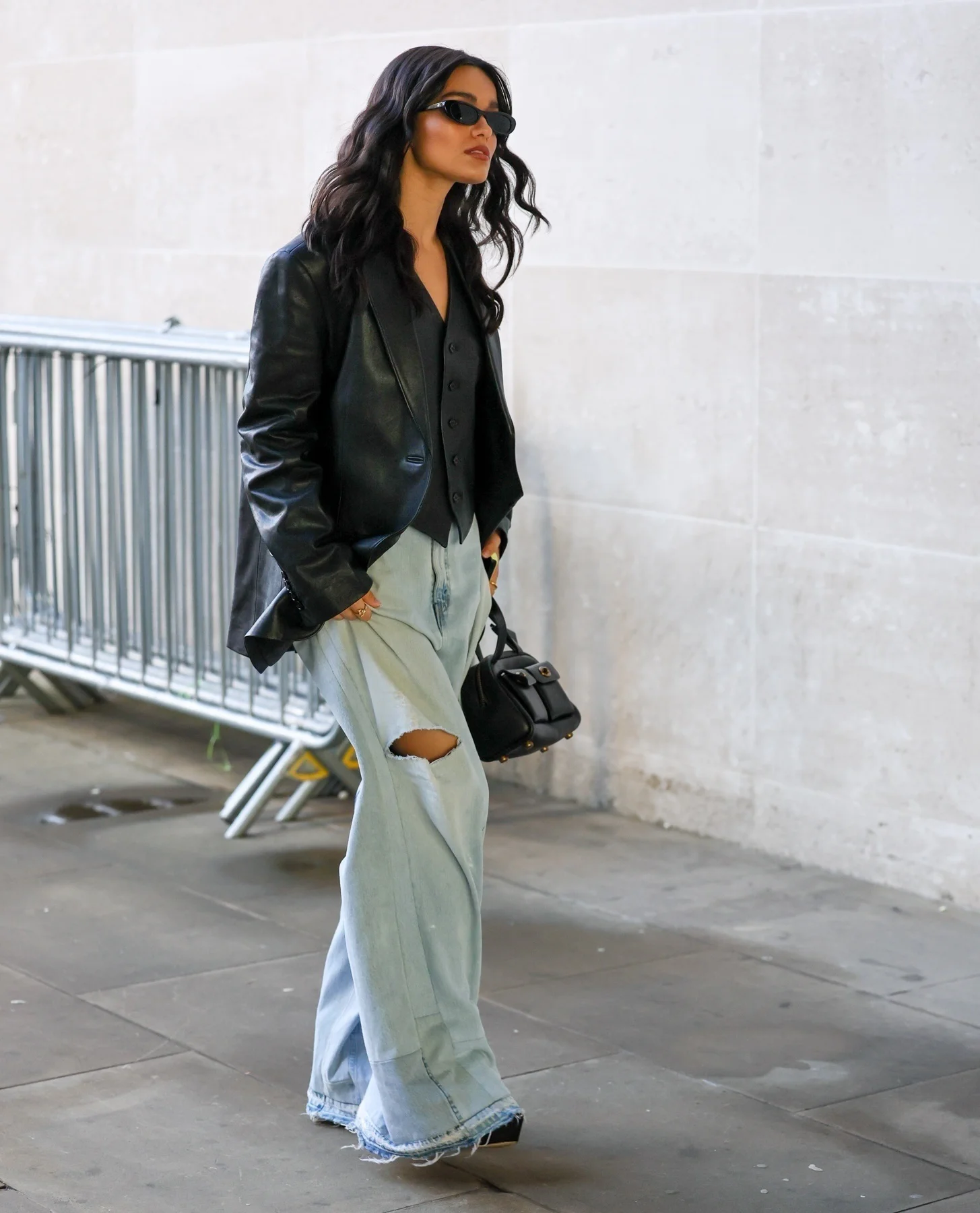 Edgy Meets Casual: Black Leather Blazer with Distressed Jeans Ensemble