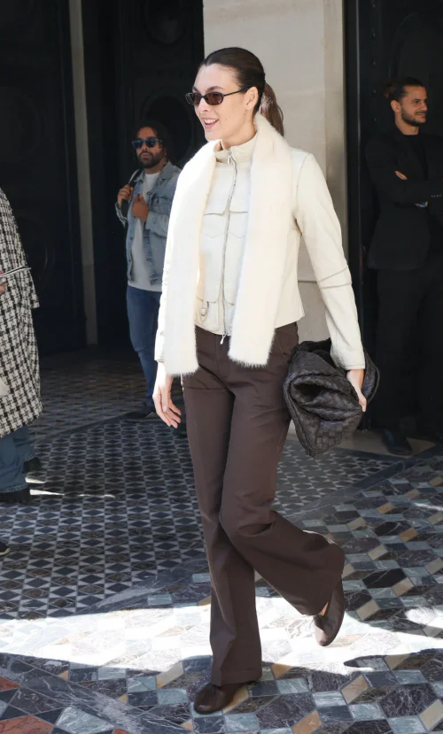 Vittoria Ceretti out in Paris. Chic Neutral Outfit with Cream Jacket and Brown Trousers for a Modern Classic Look