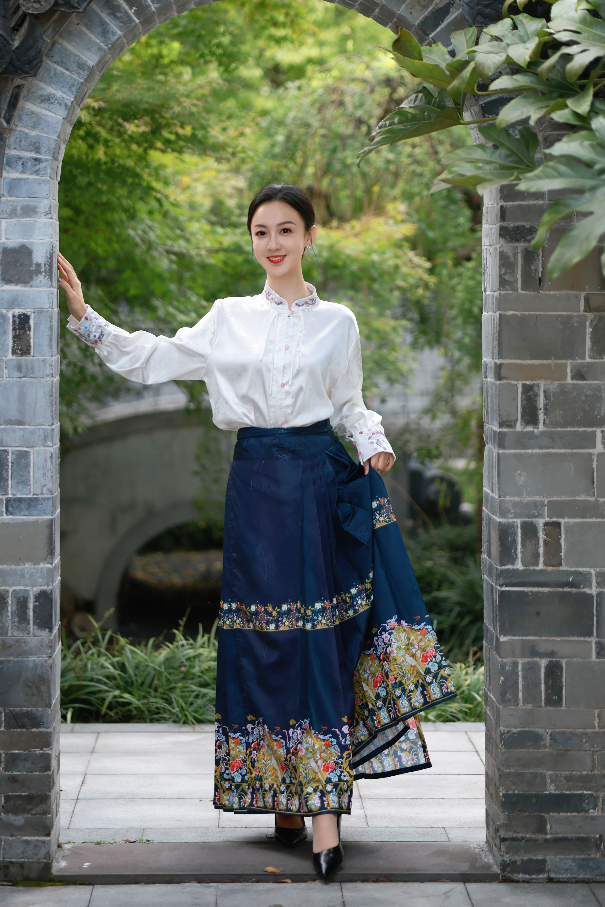 Elegant White Blouse with Embroidered Navy Skirt for a Traditional Chic Look