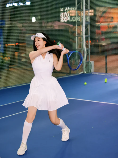 Classic White Tennis Dress with Sneakers and Visor for a Timeless Sports Look