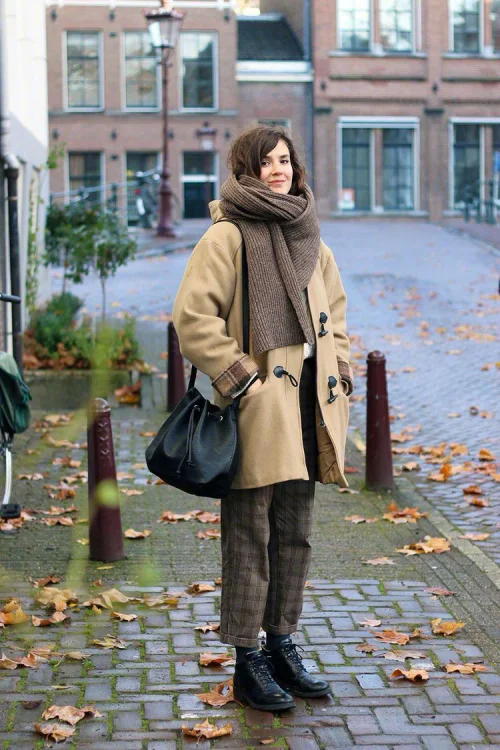 Cozy Winter Style: Beige Toggle Coat with Plaid Trousers and Knit Scarf