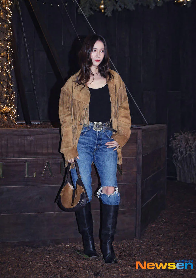 Chic Western Style: Suede Fringe Jacket, Distressed Jeans, and Black Boots Ensemble