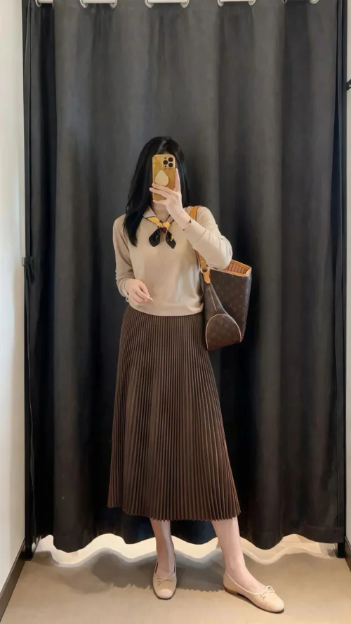 Elegant Neutral Tones with Pleated Skirt and Cozy Sweater Ensemble