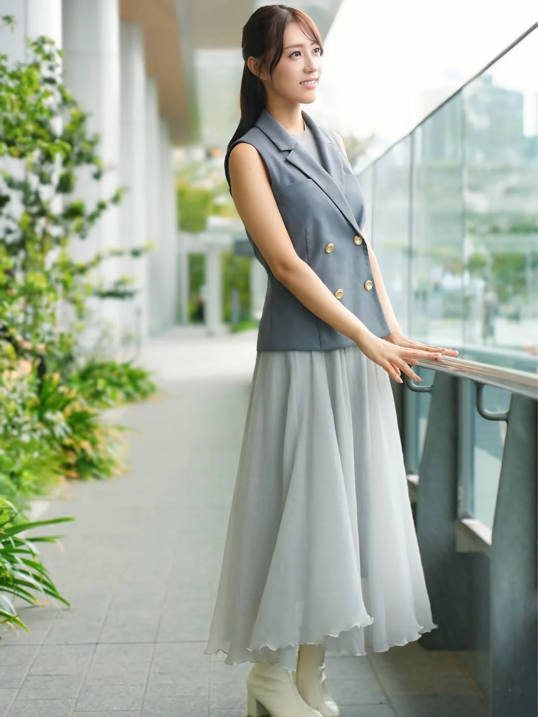 Elegant Sleeveless Vest and Sheer Gray Skirt with Gold Accents