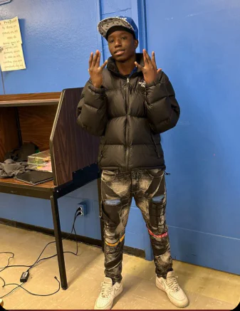 Urban Streetwear Look with Black Puffer Jacket and Graphic Jogger Pants