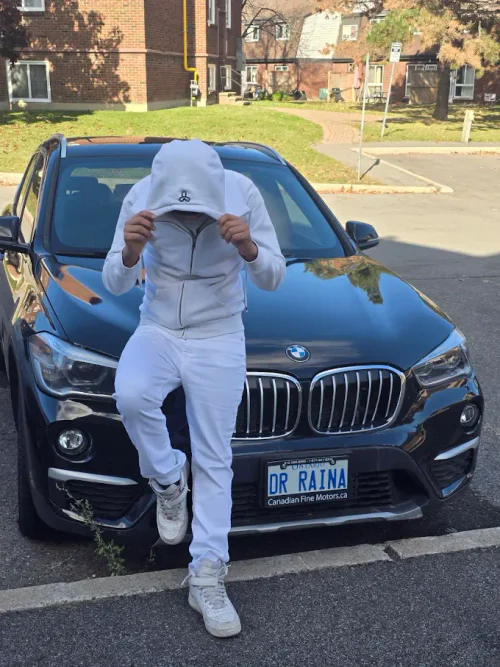 Monochromatic White Athleisure: Hoodie, Joggers, and Sneakers Ensemble