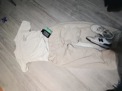 Casual Comfort with Graphic Tee, Beige Joggers, and Sporty Sneakers