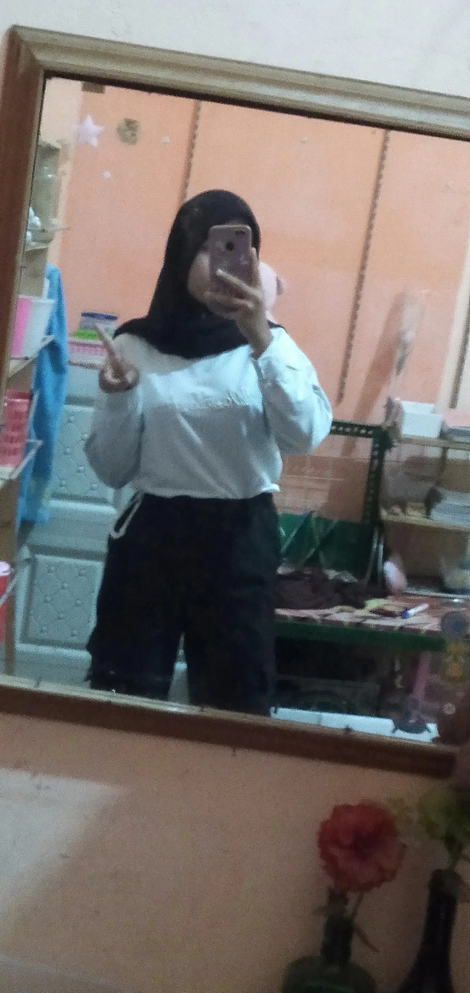 Classic Monochrome Style: White Top with Black High-Waisted Pants and Hijab