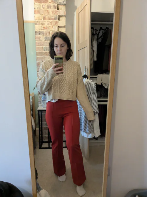Cozy Beige Sweater with Bold Red Pants for a Stylish Retro Look