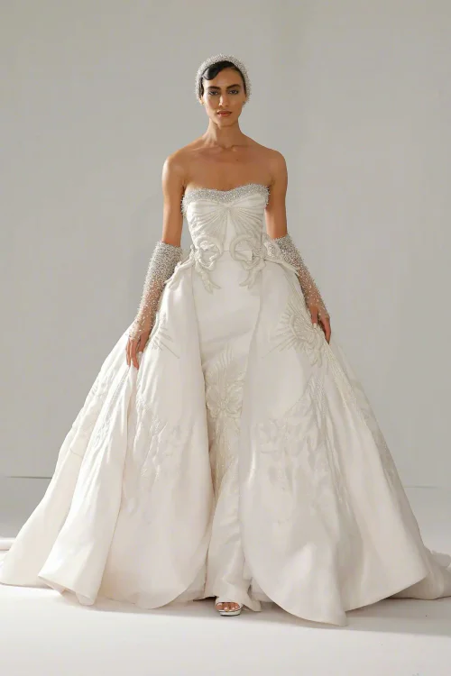 Elegant Strapless Bridal Gown with Embroidered Skirt and Embellished Gloves