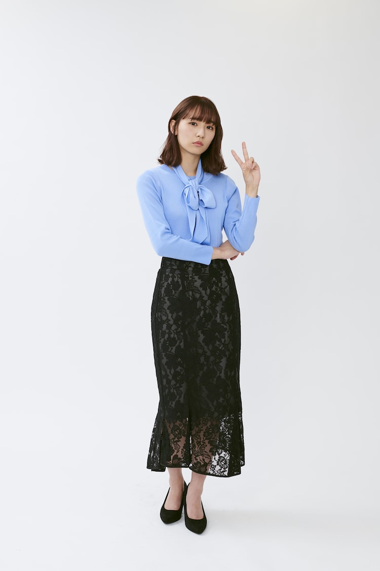 Blue blouse with black lace skirt, dignified and a little sexy