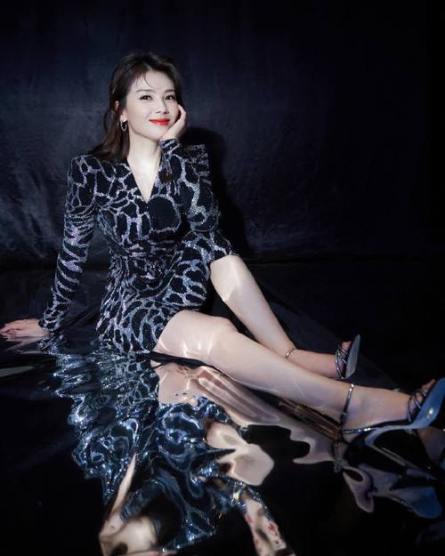Stylish dress and heels. Chinese female star Liu Tao
