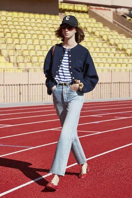 Chanel jacket paired with straight-leg jeans.